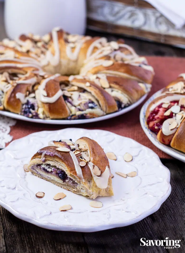 A piece of blueberry cream cheese stollen on a saucer