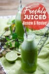green juice in a jar with a straw