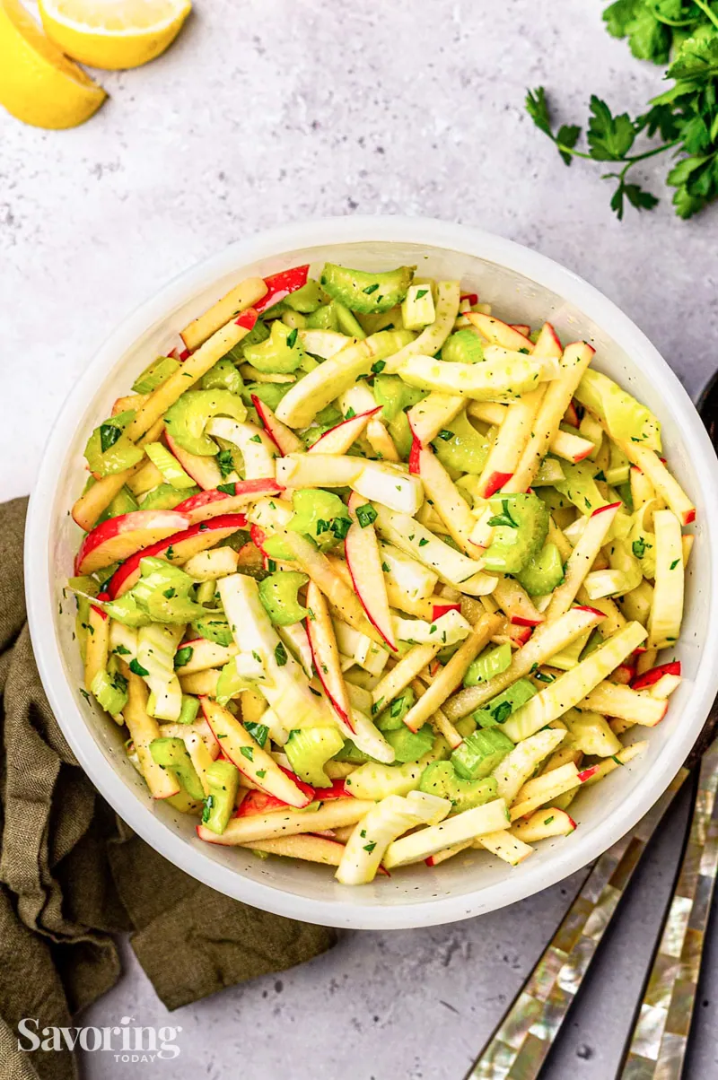 Fennel, apples and celery chopped slaw in a white bowl