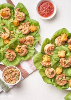 Shrimp wraps on a platter with dipping sauce