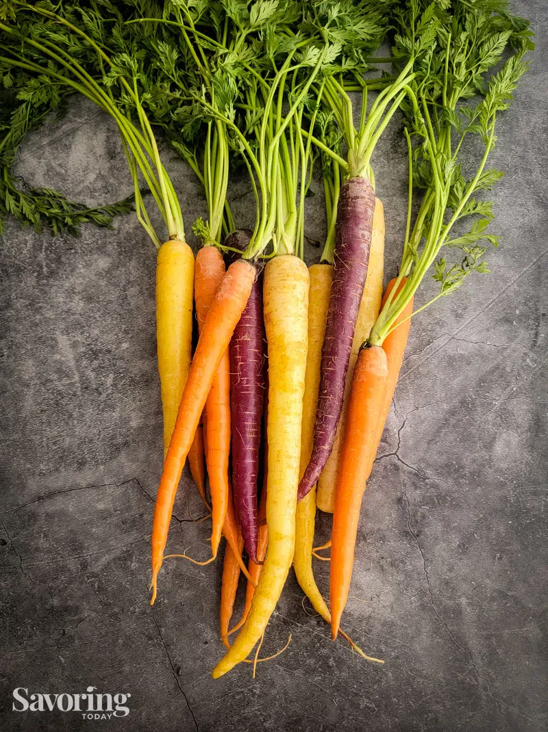 rainbow carrots on a grey background