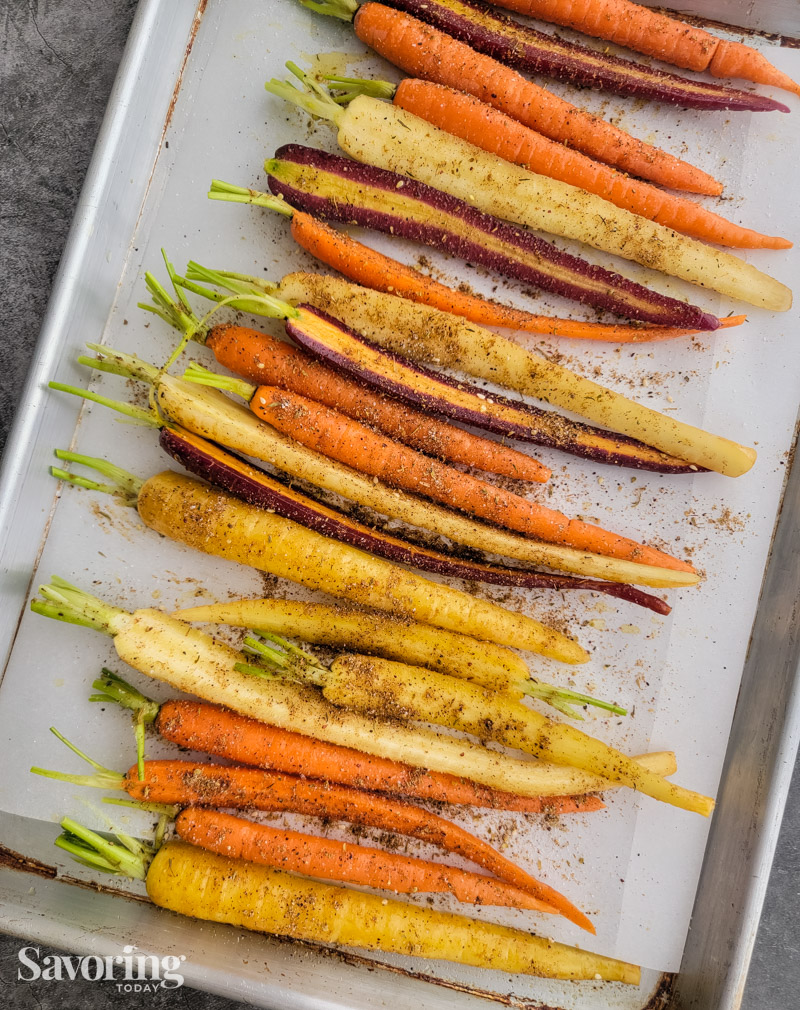 carrots on a pan ready to be roasted