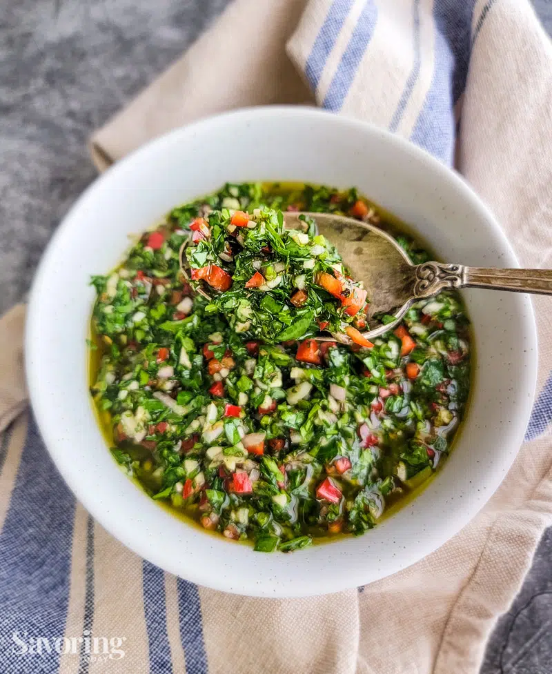 chimichurri sauce in a white bowl