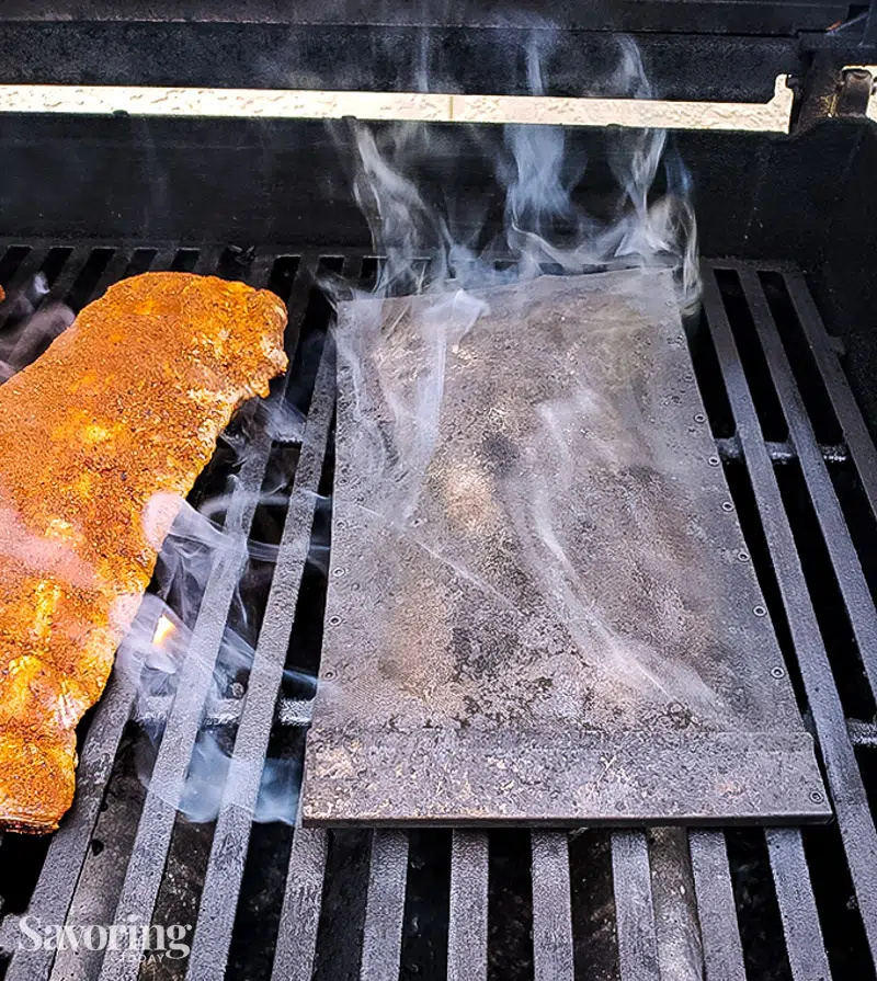 smoker packet on a gas grill with ribs
