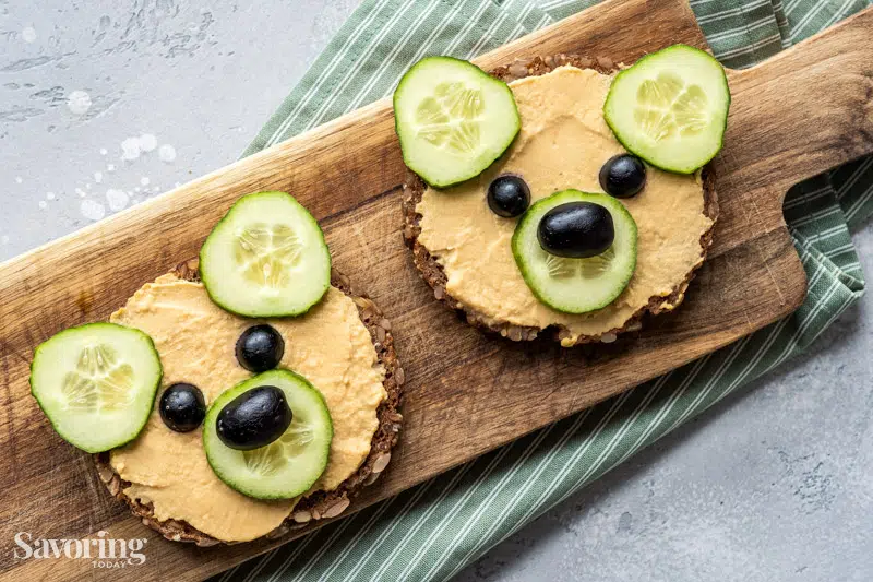 hummus bear with cucumber and olives in the shape of a bear