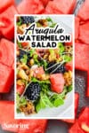 arugula watermelon salad with cubed watermelon background