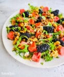 Arugula watermelon salad with blackberries and walnuts
