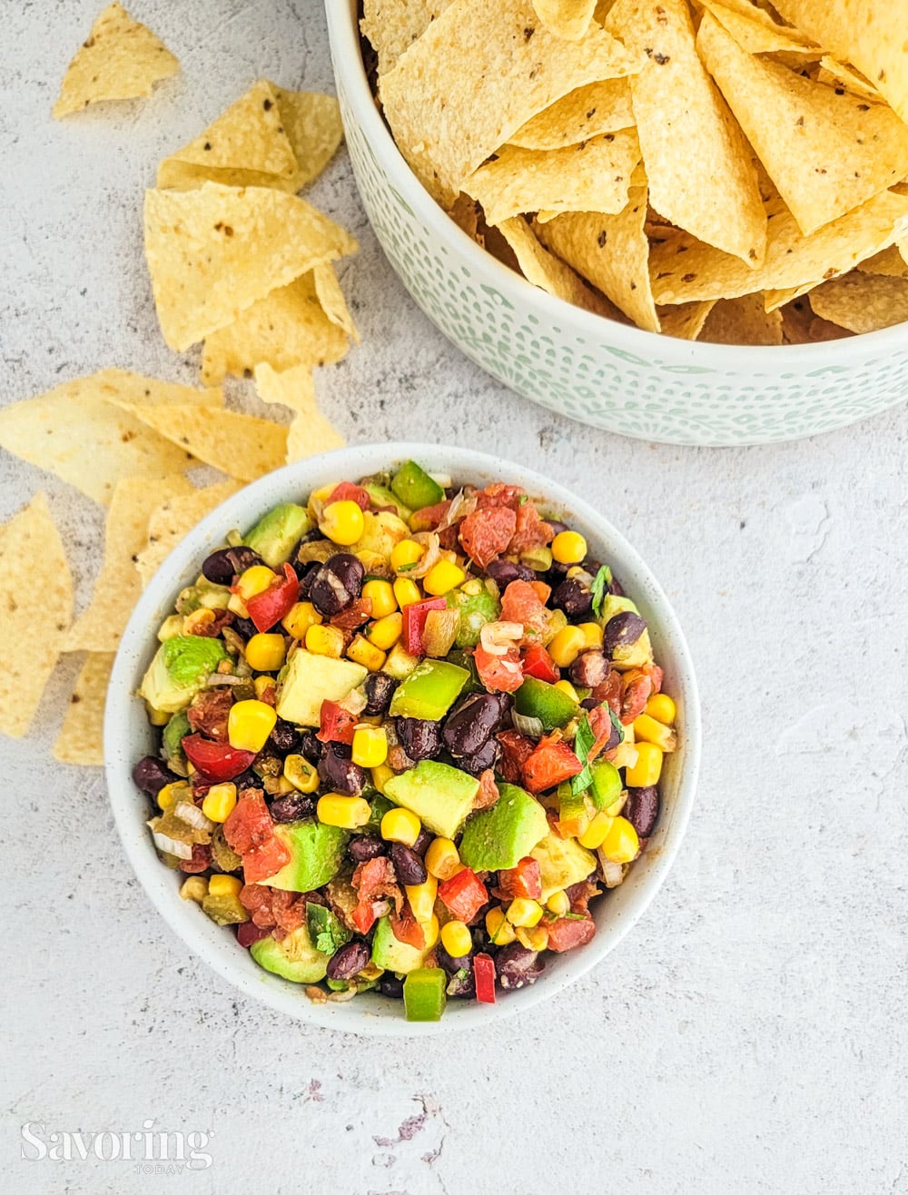 black bean salsa on a marble counter with chips