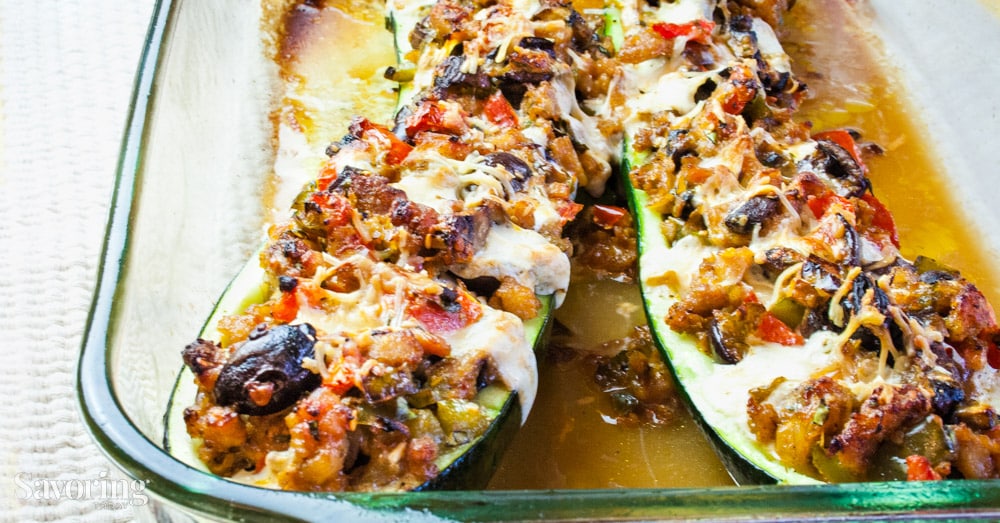 zucchini stuffed with meat, cheese, and olives