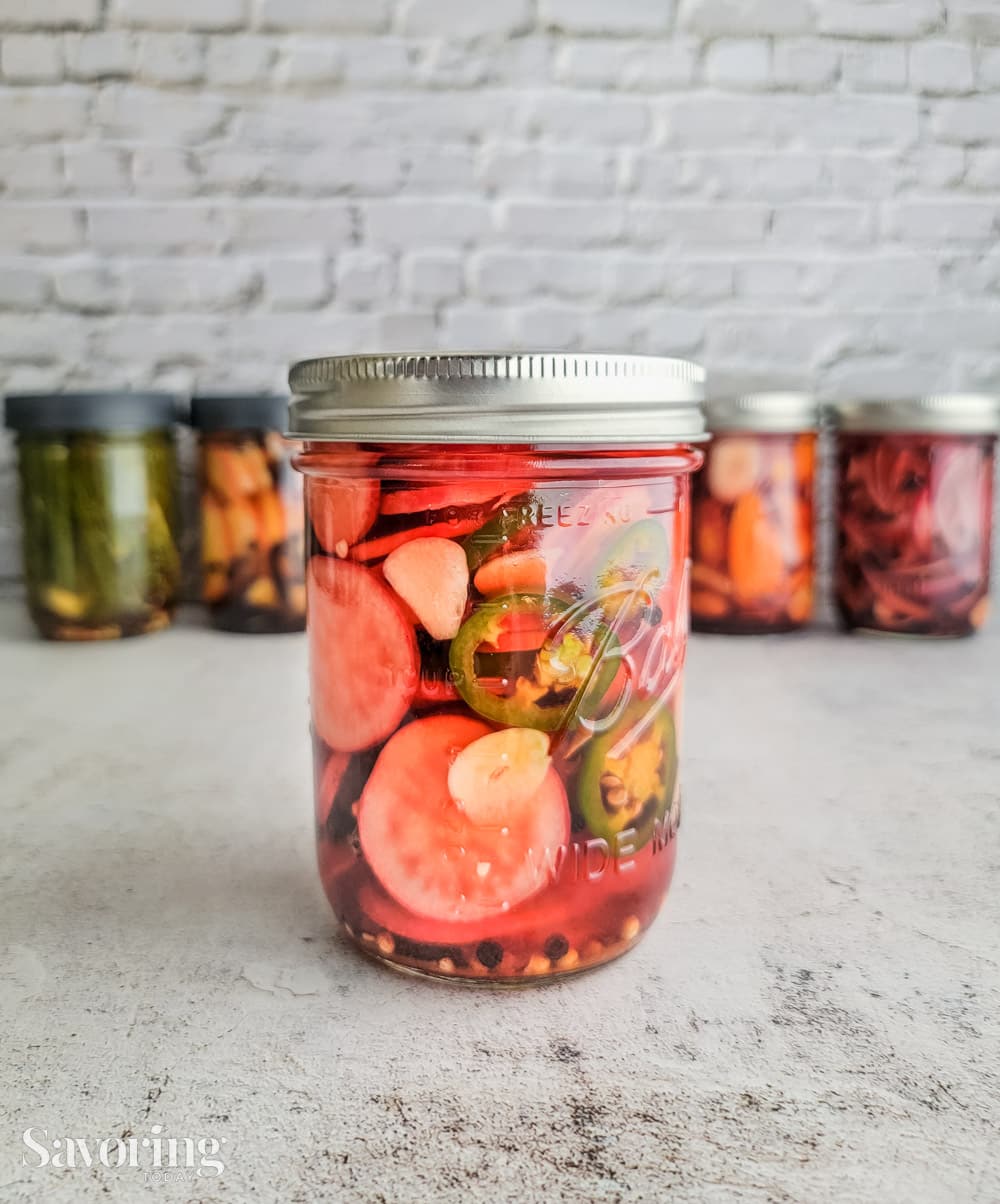 jalapeno radish pickles in a pint jar with a lid
