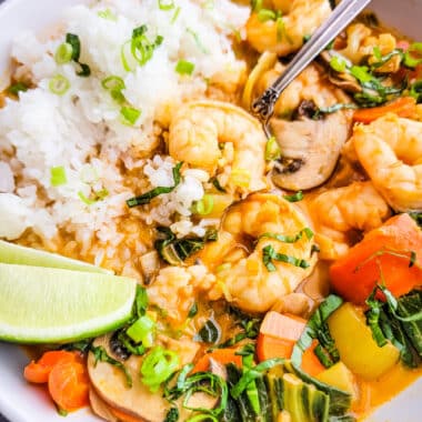 Shrimp and vegetables in a red curry sauce with rice