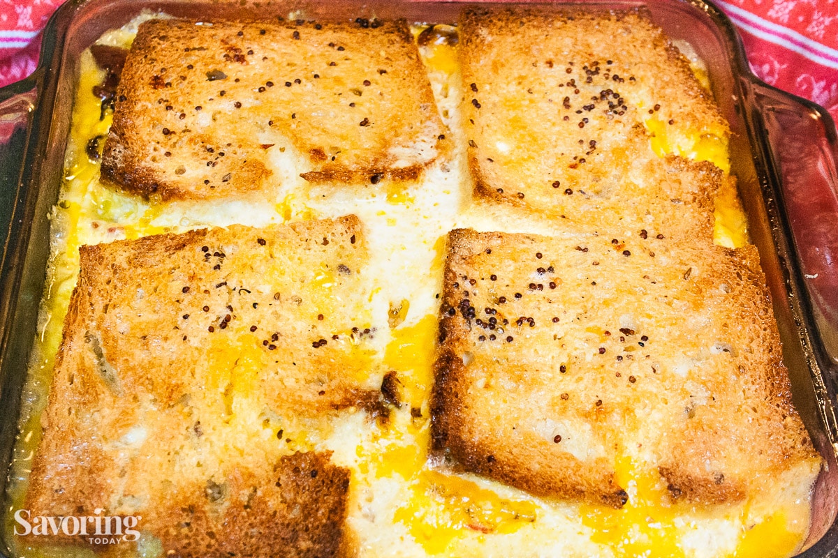 Casserole with golden brown bread crust on the top in a baking dish