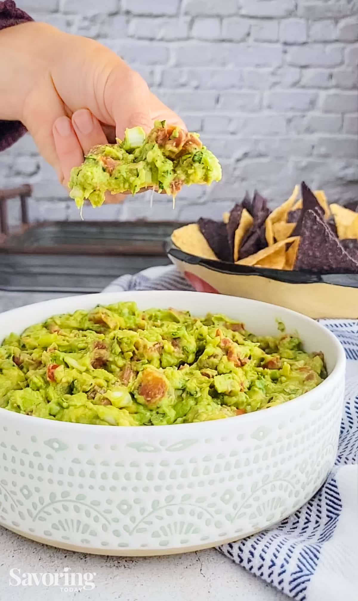 guacamole scooped up on a chip