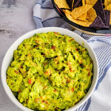 guacamole and chips on a table