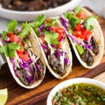mushroom tacos with chimichurri, cabbage, tomatoes and cilantro