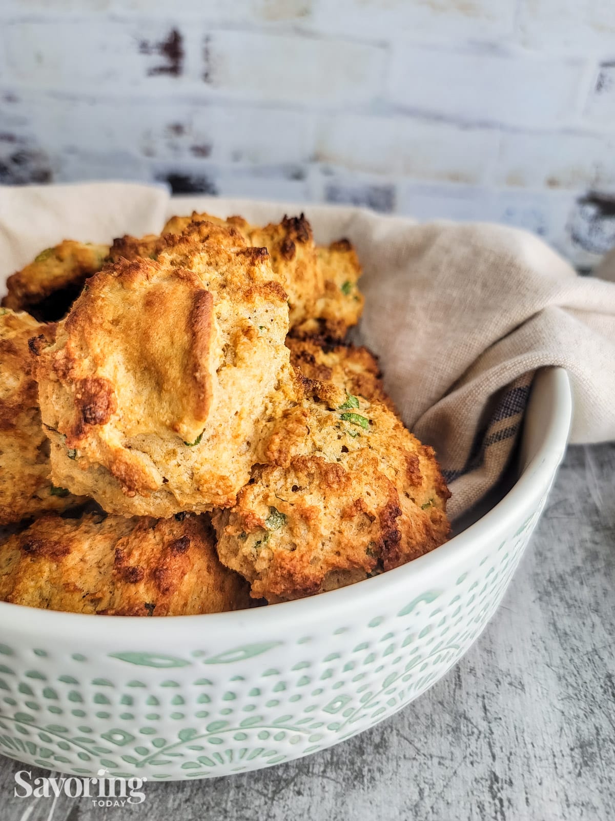 drop biscuits in a bowl on top of a towel