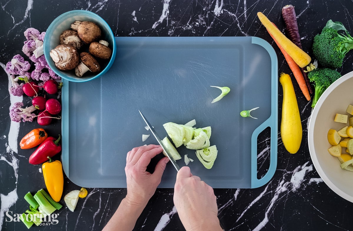 chopping fennel on a cutting board