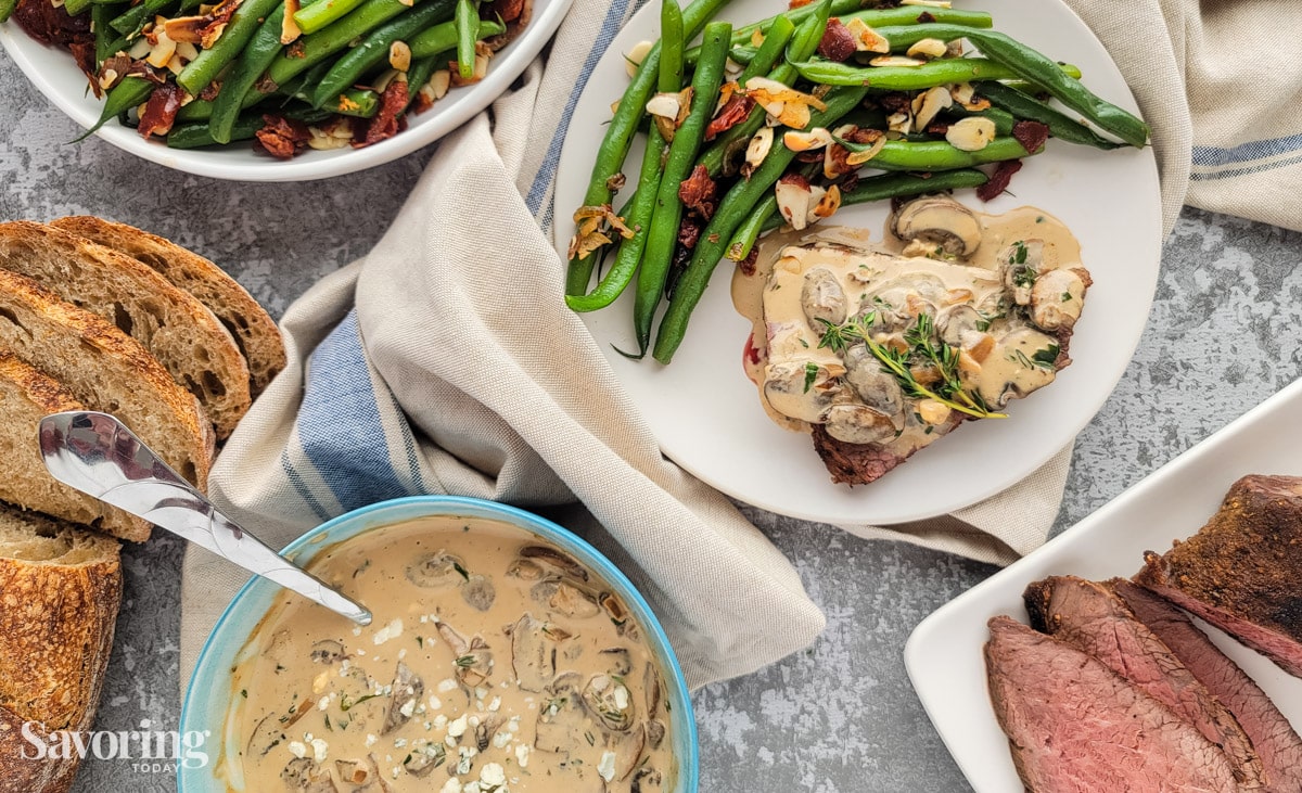 a feast of roast tri-tip, mushroom sauce, green beans, and sourdough bread