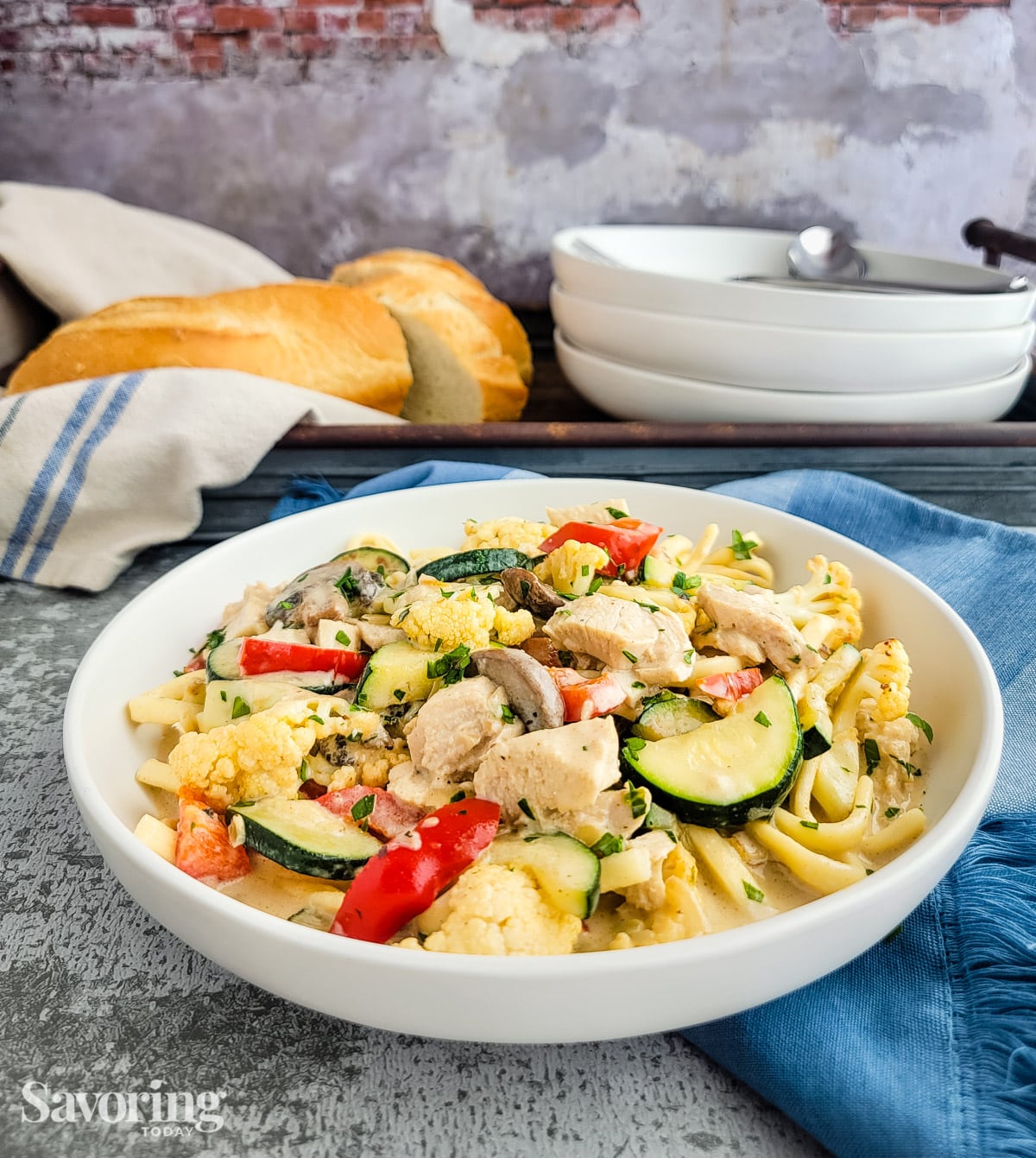 Turkey and vegetable tetrazzini served in a white bowl