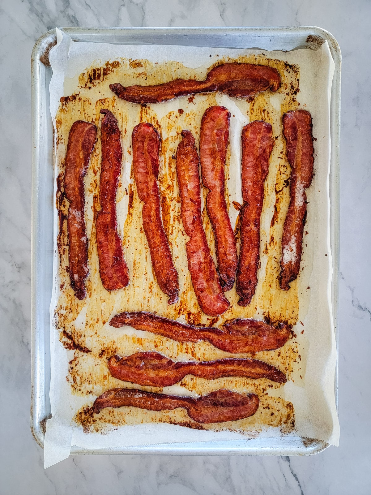 Crispy oven cooked bacon on a sheet pan 