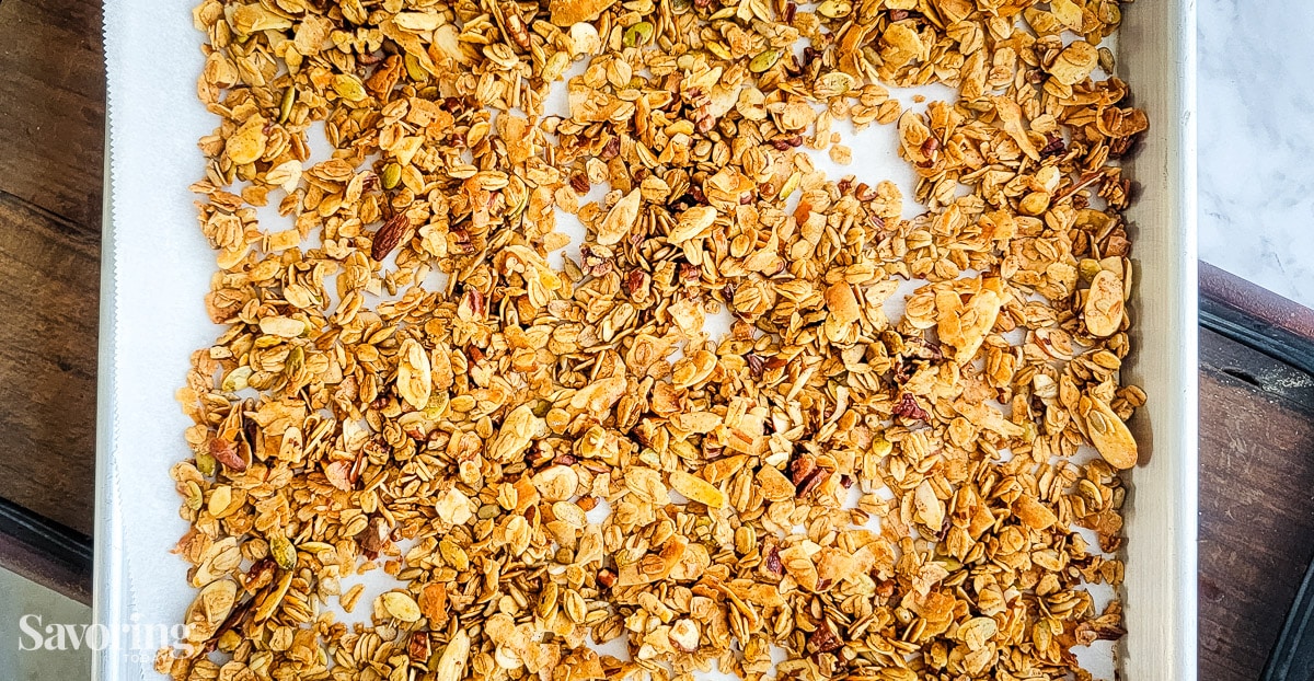 close up of golden baked granola on a sheet pan
