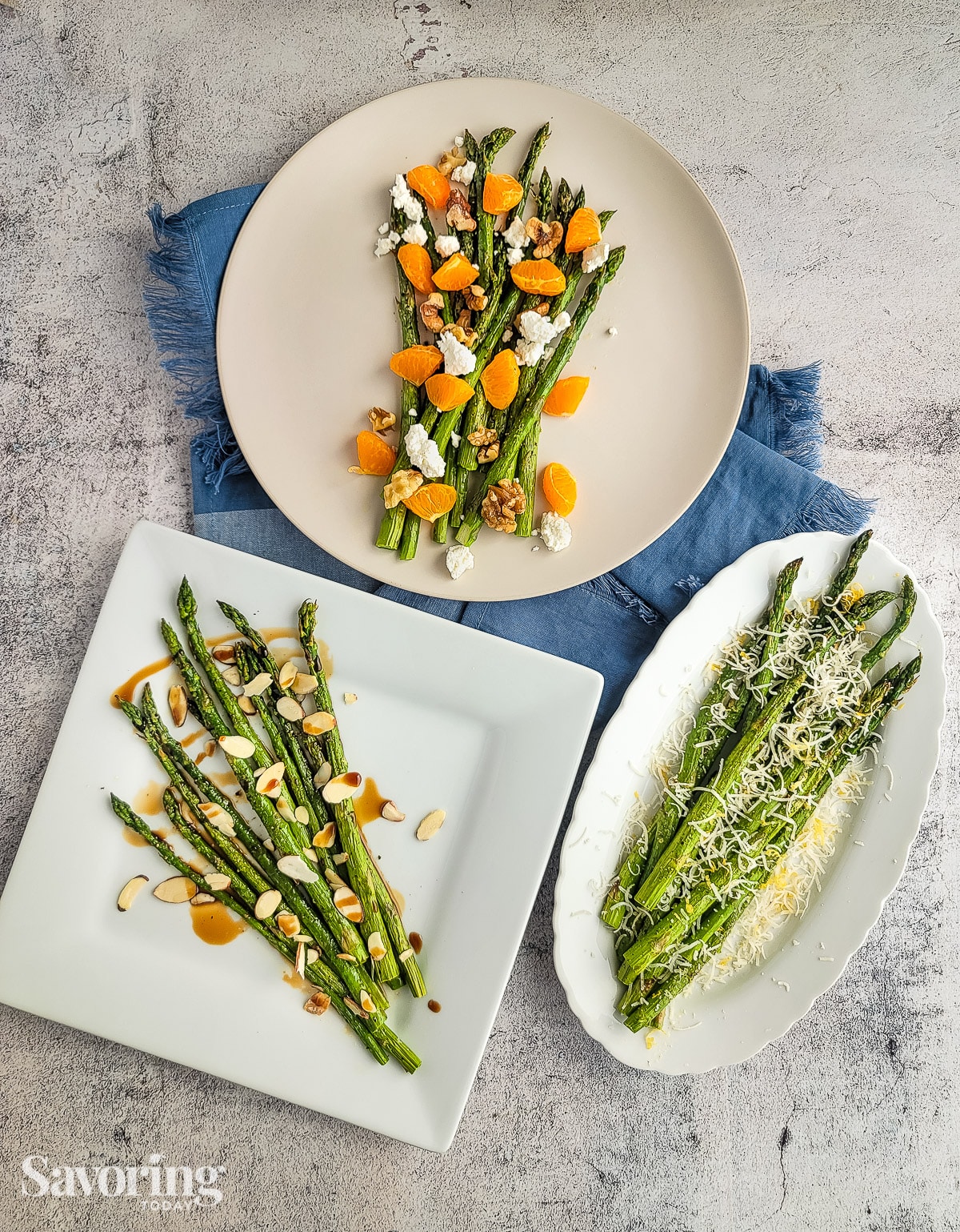Roasted asparagus on plates over a blue towel