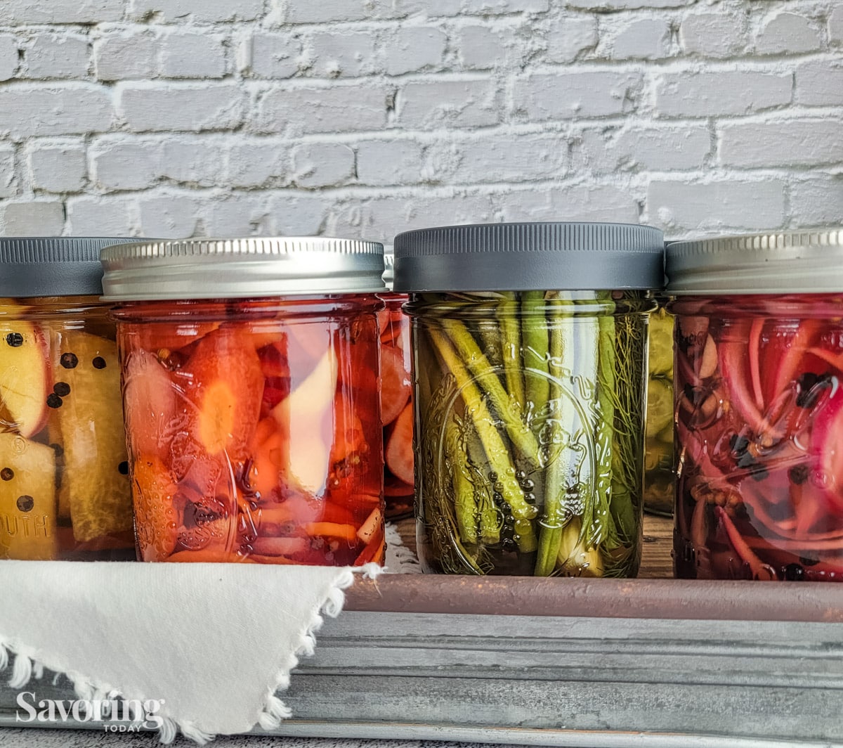 Dilly beans in a row of quick pickles.