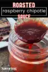 raspberry chipotle sauce on a spoon over a jar with pinterest banner