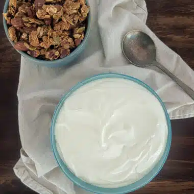 homemade Greek yogurt on a table with granola