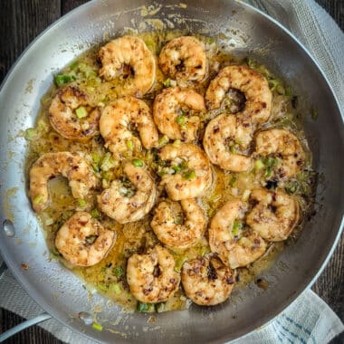 chili crunch grilled shrimp in saucepan with miso butter sauce