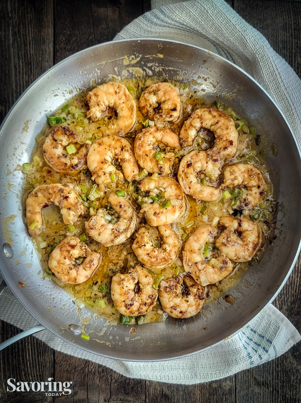 chili crunch grilled shrimp in saucepan with miso butter sauce