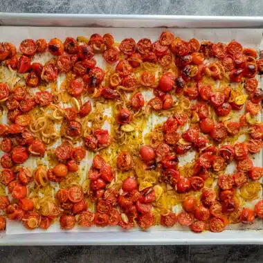 roasted tomato, shallot, garlic medley on a pan fresh from the oven