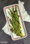 Hoisin glazed roasted aparagus on a platter