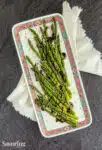 Hoisin glazed roasted aparagus on a platter