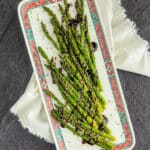Hoisin glazed roasted aparagus on a platter