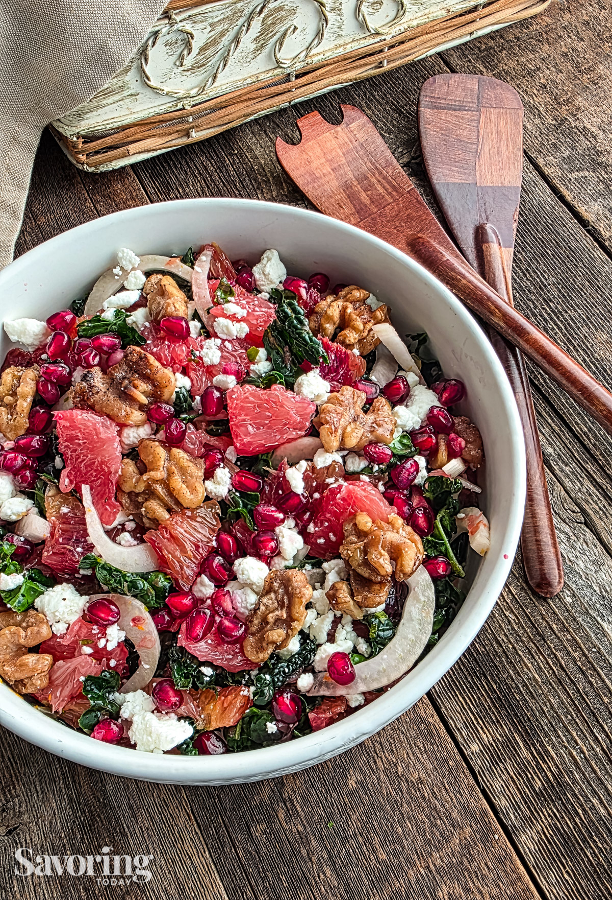 Grapefruit and blood orange salad with kale and fennel on a wood table 